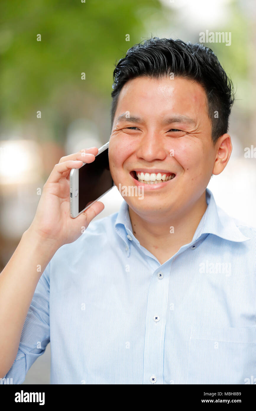 Young Japanese businessman downtown Tokyo Stock Photo