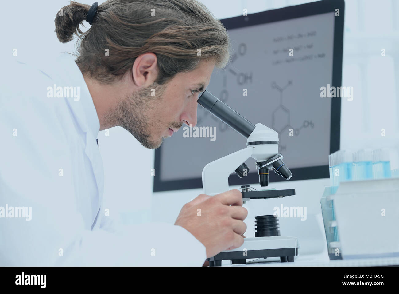 senior lab technician using microscope in laboratory Stock Photo Alamy