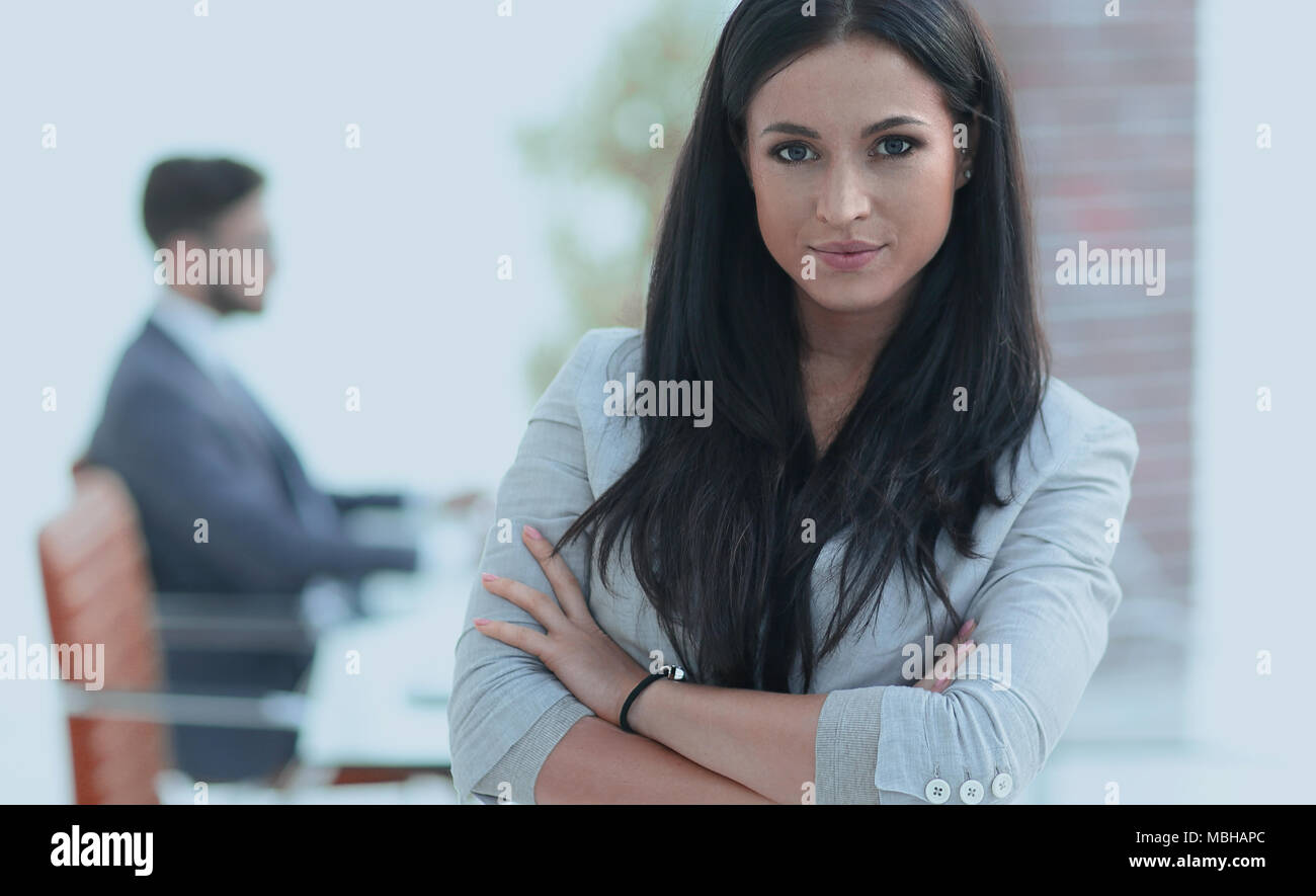 portrait of a successful young business woman on the office background ...