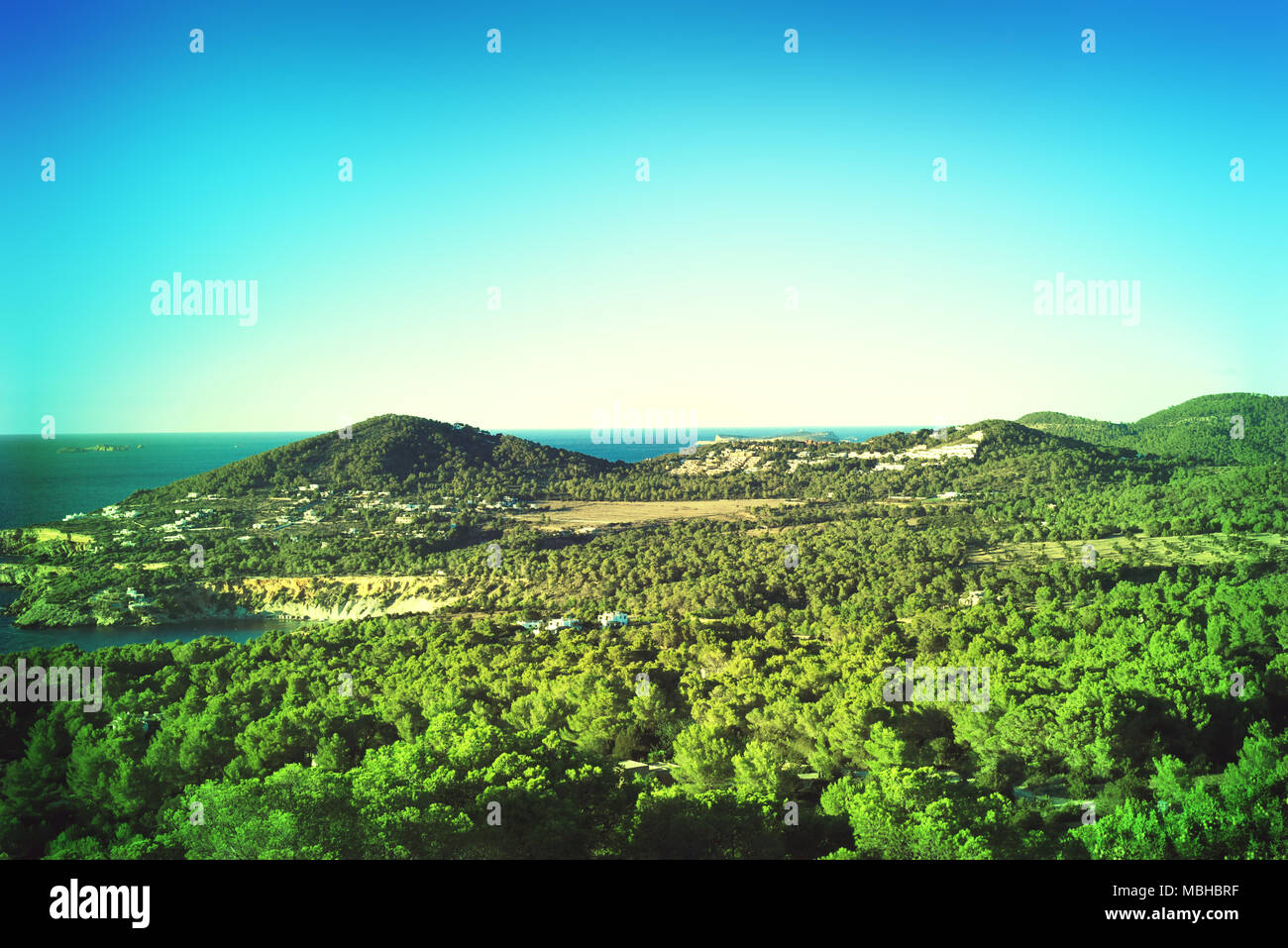View over Ibiza Island with green hills and coastline. Beautiful summer day on ibiza, countryside. Stock Photo