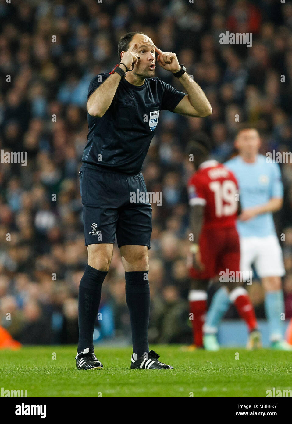 Referee Antonio Mateu Lahoz gestures during the UEFA Champions League Quarter Final second leg match between Manchester City and Liverpool at the Etihad Stadium on April 10th 2018 in Manchester, England. (Photo by Daniel Chesterton/phcimages.com) Stock Photo