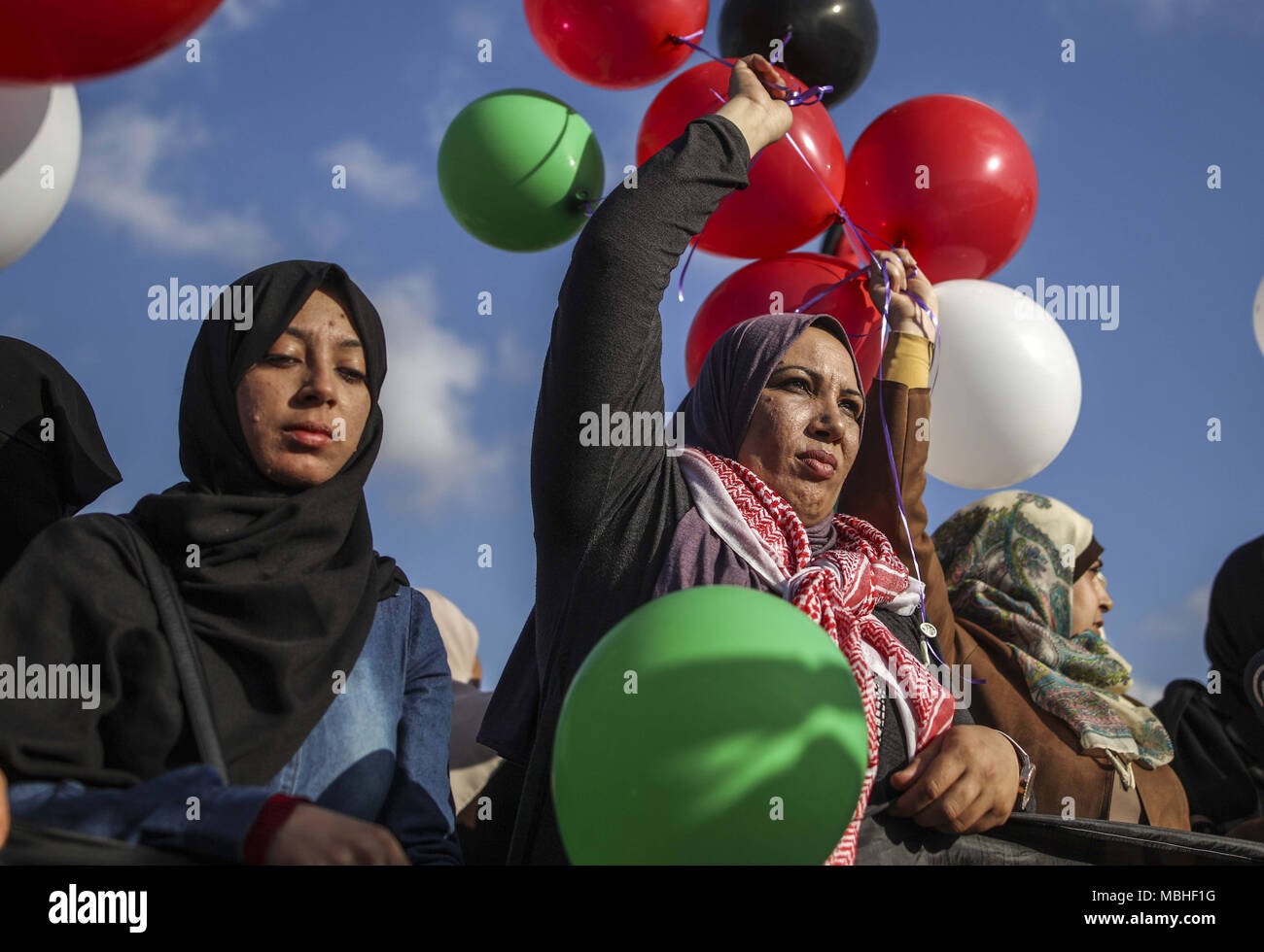 Gaza. 10th Apr, 2018. Palestinian women hold balloons during a protest near the border between eastern Gaza and Israel, on April 10, 2018. The mass protest, known as the 'Great March of Return,' demands Palestinian refugees' right to return to their homes occupied by Israel. Credit: Wissam Nassar/Xinhua/Alamy Live News Stock Photo