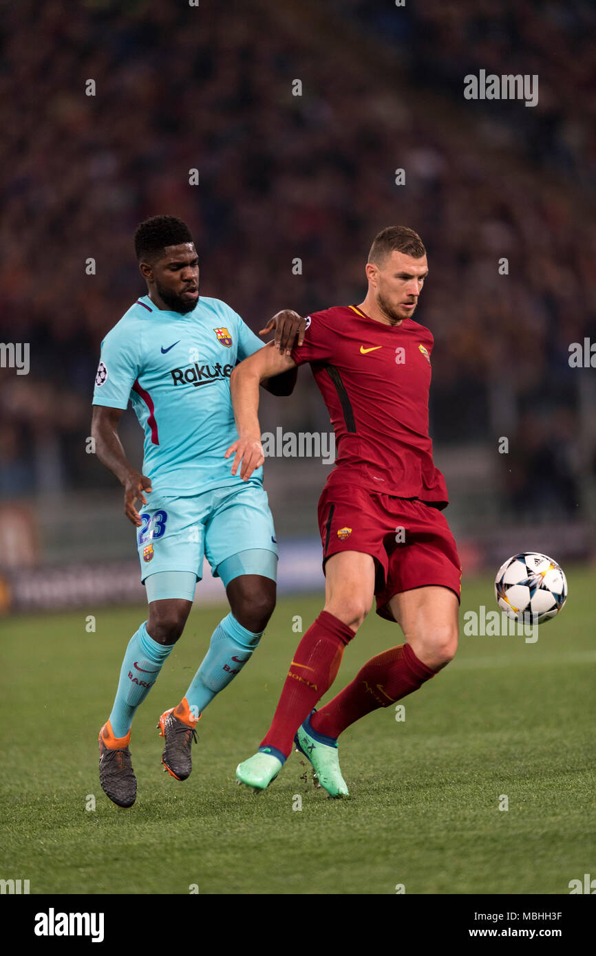 Edin Dzeko of Roma and Samuel Umtiti of Barcelona during the Uefa "  Champions League " Quarter-finals, 2st leg, match between Roma 3-0  Barcelona at Olimpic Stadium on April 10, 2018 in