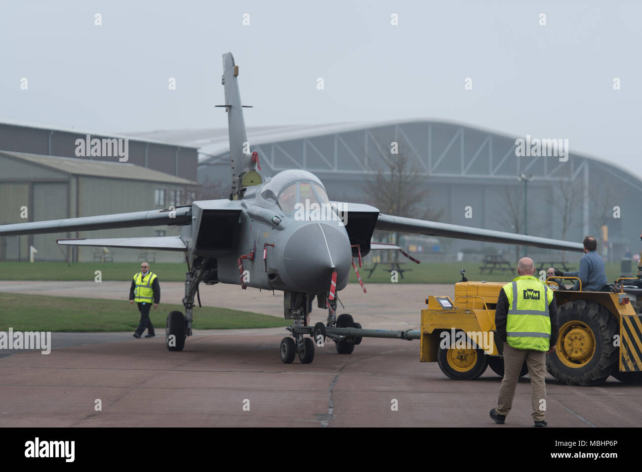 IWM Duxford, Cambridgeshire, UK. 11 April 2018. Imperial War Museums, working with RAF Marham, add Tornado GR4 ZA469 to the displays at IWM Duxford. Tornado GR4 ZA469 is transported from the Conservation Hall in AirSpace to the Battle of Britain exhibition, where it goes on display to visitors from 11 April 2018. The Tornado GR4 is the most significant combat jet used by the RAF during the last 27 years and continues in service until 2019. Credit: Malcolm Park/Alamy Live News. Stock Photo