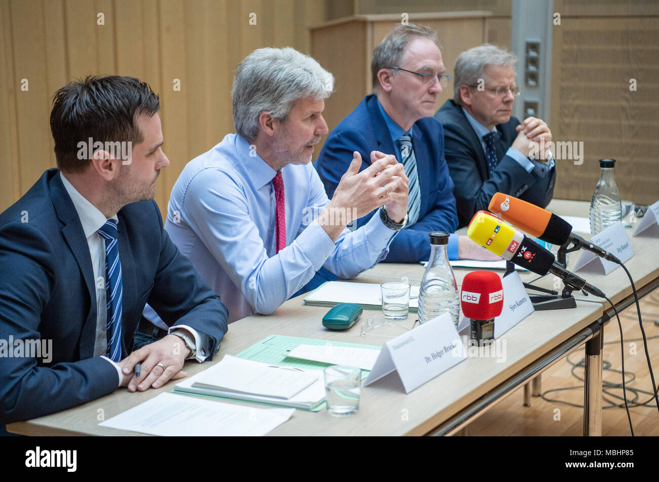 11 April 2018, Germany, Berlin: Holger Brocke (l-r), public prosecutor; Sjors Kamstra, Oberstaatsanwalt (senior public prosecutor); Joerg Raupach, head of the Berlin public prosecution office; and Martin Steltner, press spokesman of the Berlin Strafverfolgungsbehoerden (lit. law enforcement agencies) answer questions from the media at a press conference on the subject of document tampering in the Anis Amri case. Photo: Christophe Gateau/dpa Stock Photo