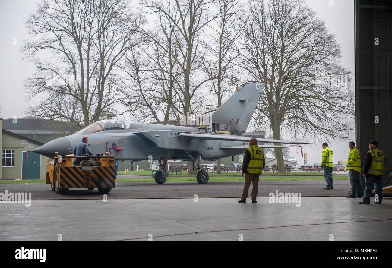 IWM Duxford, Cambridgeshire, UK. 11 April 2018. Imperial War Museums, working with RAF Marham, add Tornado GR4 ZA469 to the displays at IWM Duxford. Tornado GR4 ZA469 is transported from the Conservation Hall in AirSpace to the Battle of Britain exhibition, where it goes on display to visitors from 11 April 2018. The Tornado GR4 is the most significant combat jet used by the RAF during the last 27 years and continues in service until 2019. Credit: Malcolm Park/Alamy Live News. Stock Photo