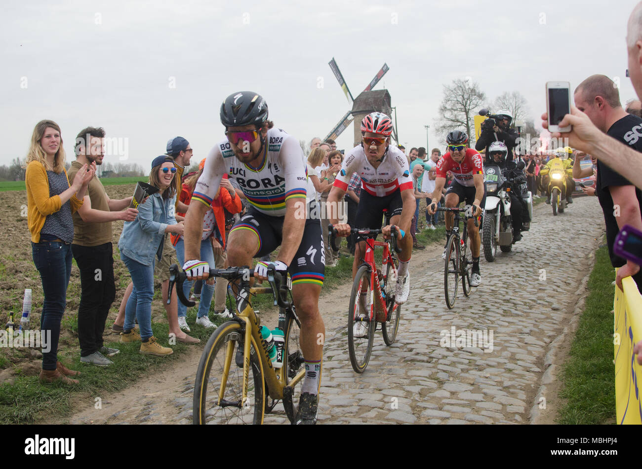 Templeuve, France, 8th April, 2018. World Champion Peter Sagan takes the lead on the Templeuve - Moulin-de-Vertain cobble sector on his way to winning the 116th Paris-Roubaix one-day professional men's bicycle road race in northern France. Credit: Lenore Humes. Stock Photo