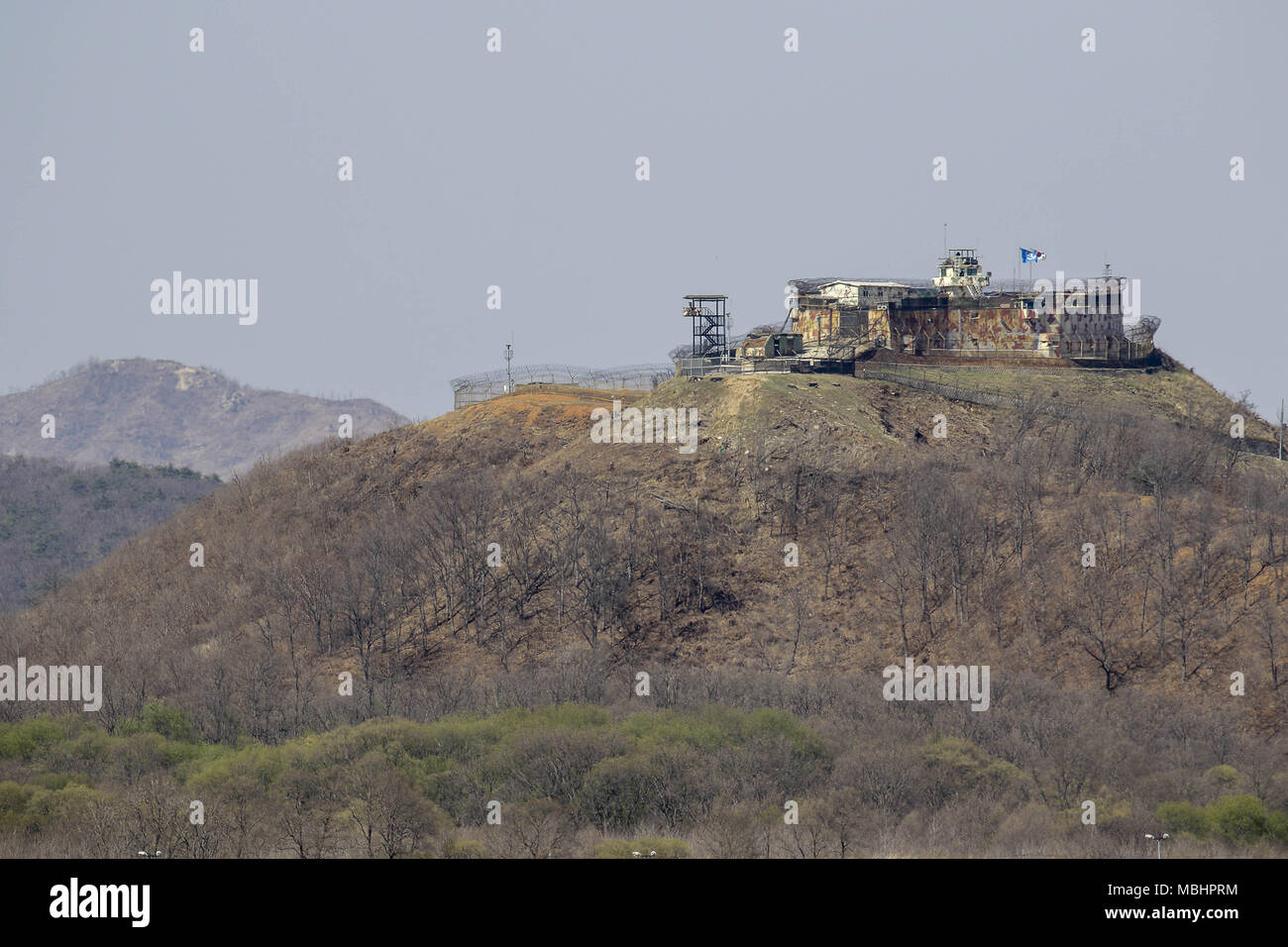 Cheorwon, GANGWON, SOUTH KOREA. 11th Apr, 2018. April 11, 2018-Goyang, South Korea-A View of Korean War battle of white horse and the Civilian Control Line in Cheorwon, South Korea. The Battle of White Horse was another in a series of bloody battles for dominant hilltop positions during the Korean War. Baengma-goji was a 395-metre (1,296 ft) hill in the Iron Triangle, formed by Pyonggang at its peak and Gimhwa-eup and Cheorwon at its base, was a strategic transportation route in the central region of the Korean peninsula. White Horse was the crest of a forested hill mass that extended in a n Stock Photo