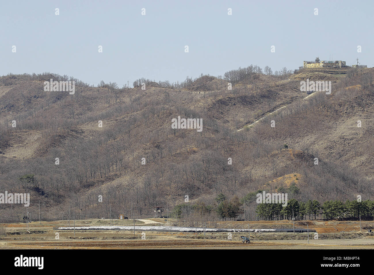 Cheorwon, GANGWON, SOUTH KOREA. 11th Apr, 2018. April 11, 2018-Goyang, South Korea-A View of Korean War battle of white horse and the Civilian Control Line in Cheorwon, South Korea. The Battle of White Horse was another in a series of bloody battles for dominant hilltop positions during the Korean War. Baengma-goji was a 395-metre (1,296 ft) hill in the Iron Triangle, formed by Pyonggang at its peak and Gimhwa-eup and Cheorwon at its base, was a strategic transportation route in the central region of the Korean peninsula. White Horse was the crest of a forested hill mass that extended in a n Stock Photo