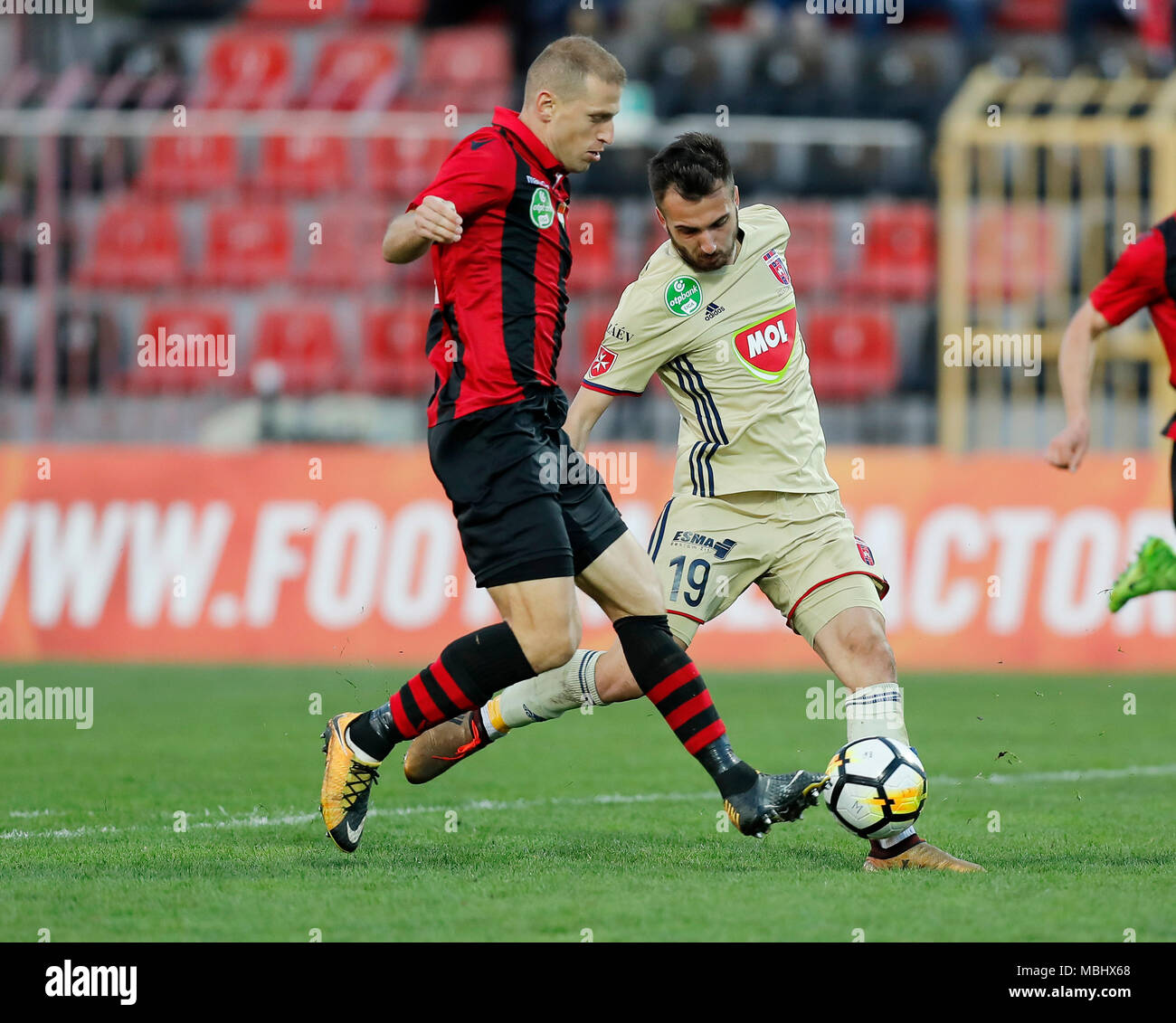 BUDAPEST, HUNGARY - APRIL 11: (l-r) Djordje Kamber of Budapest Honved competes for the ball with Boban Nikolov of Videoton FC during the Hungarian OTP Bank Liga match between Budapest Honved and Videoton FC at Bozsik Stadium on April 11, 2018 in Budapest, Hungary. Stock Photo