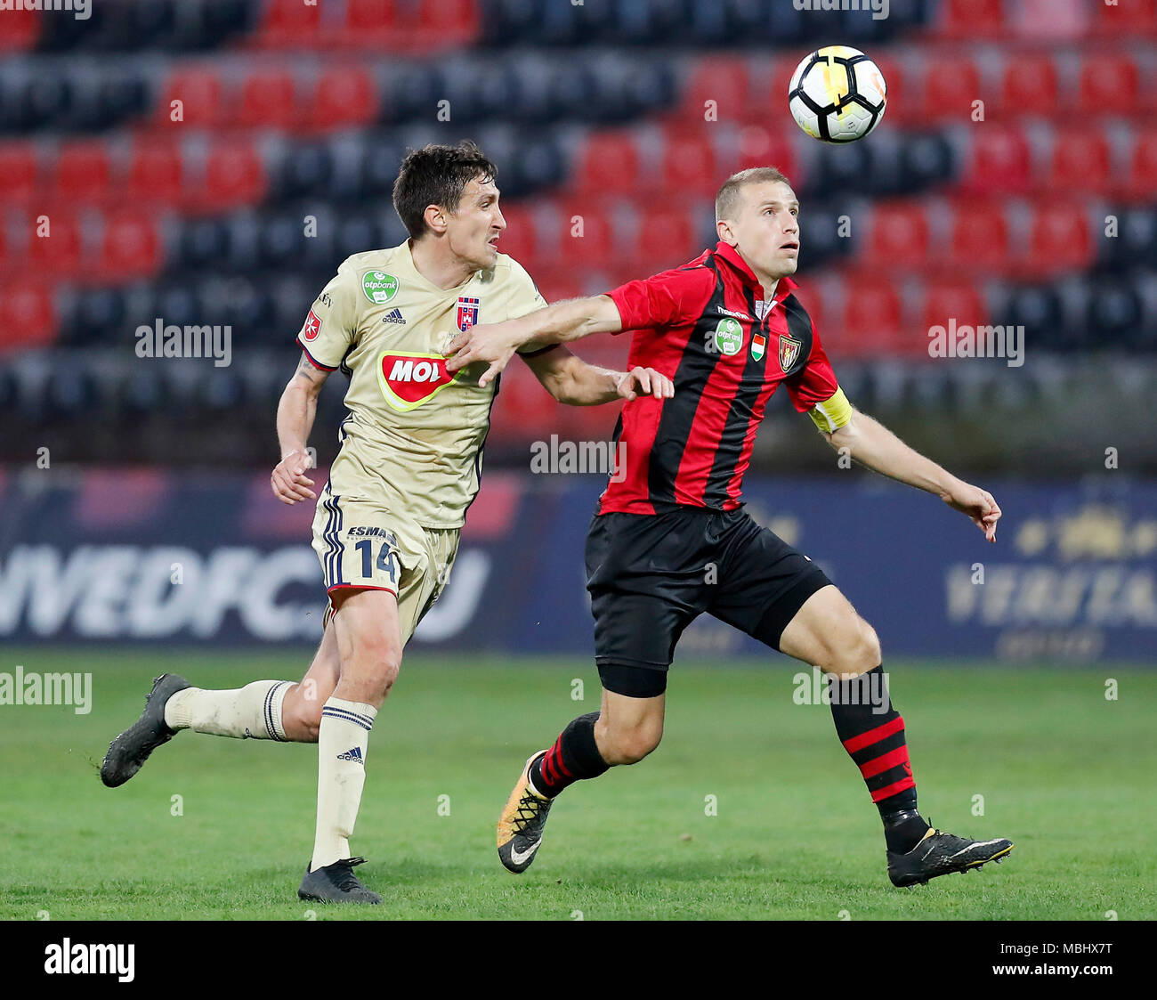BUDAPEST, HUNGARY - APRIL 11: (l-r) Stefan Scepovic of Videoton FC competes for the ball with Djordje Kamber of Budapest Honved during the Hungarian OTP Bank Liga match between Budapest Honved and Videoton FC at Bozsik Stadium on April 11, 2018 in Budapest, Hungary. Stock Photo