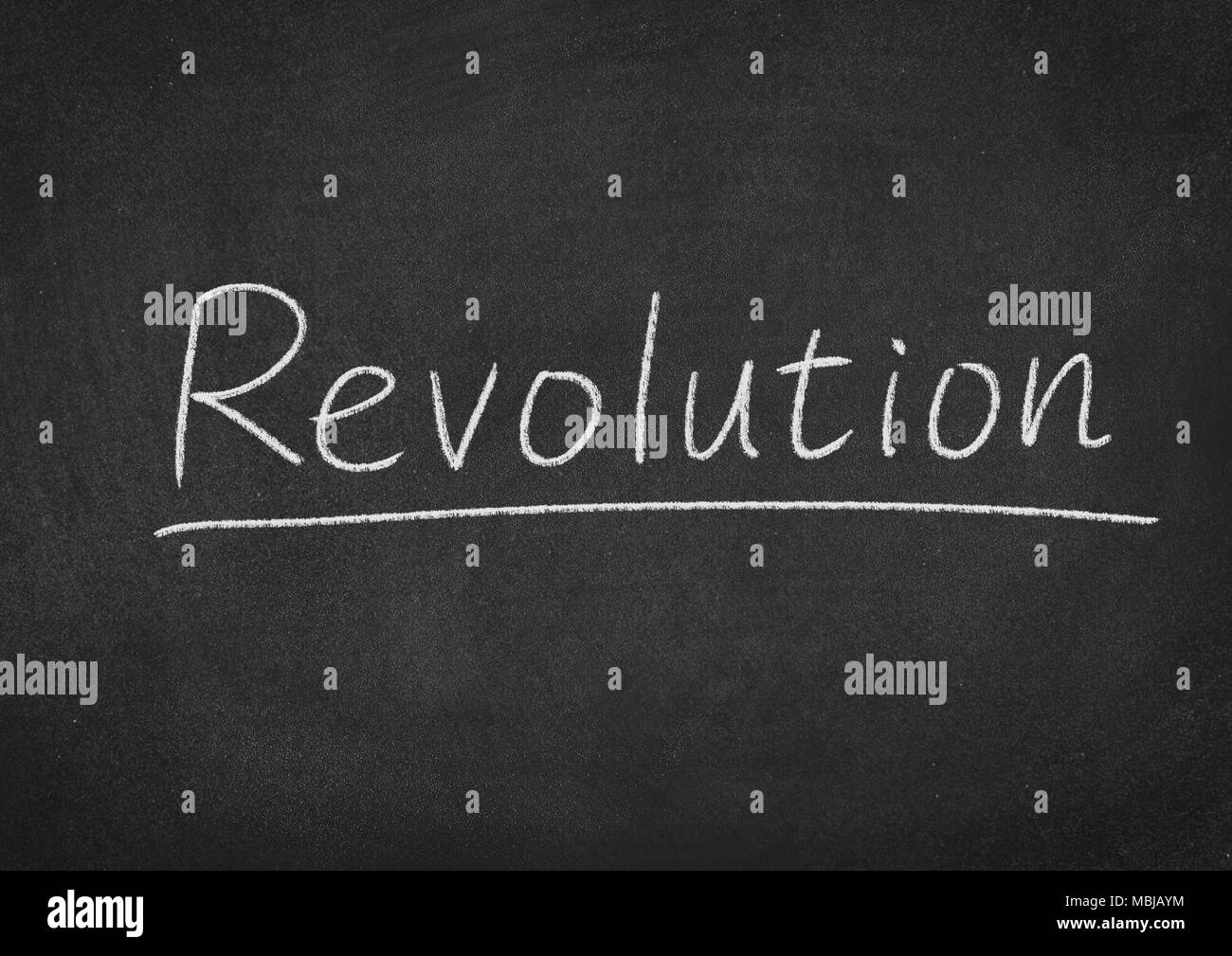 revolution concept word on a blackboard background Stock Photo - Alamy