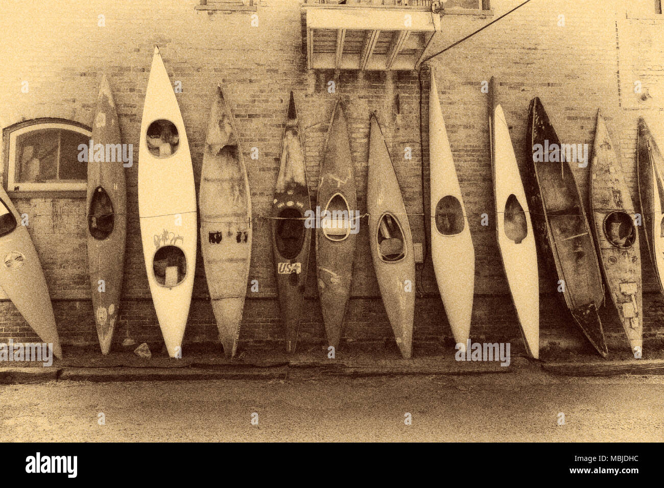 Calotype black & white view of kayaks along a historic building in downtown Salida, Colorado, USA. Stock Photo