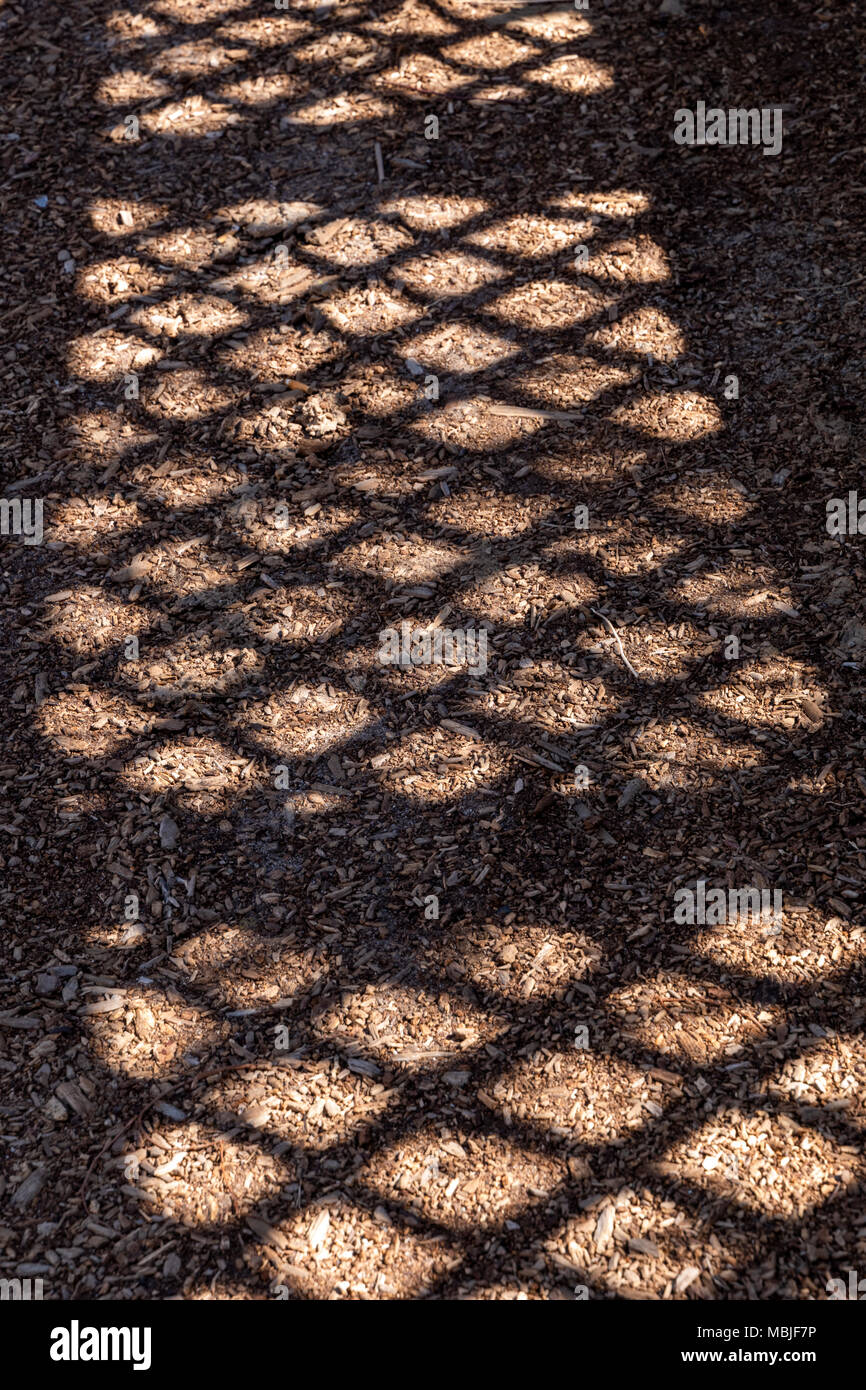 Fence creates interesting abstract shadows; National Historic District; Salida; Colorado; USA Stock Photo