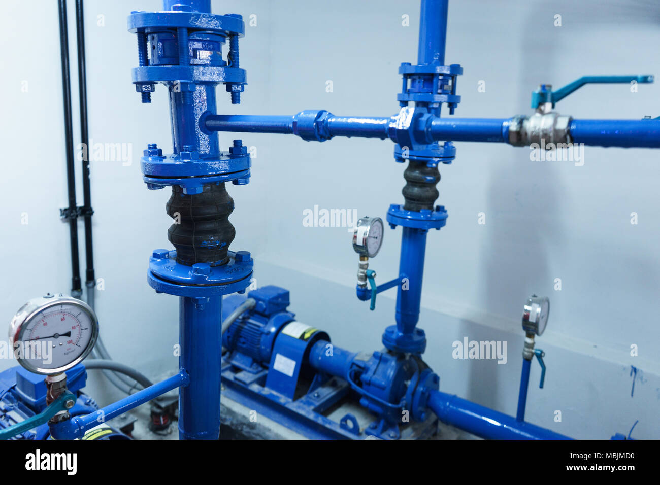 Blue Water pump on floor Stock Photo Alamy