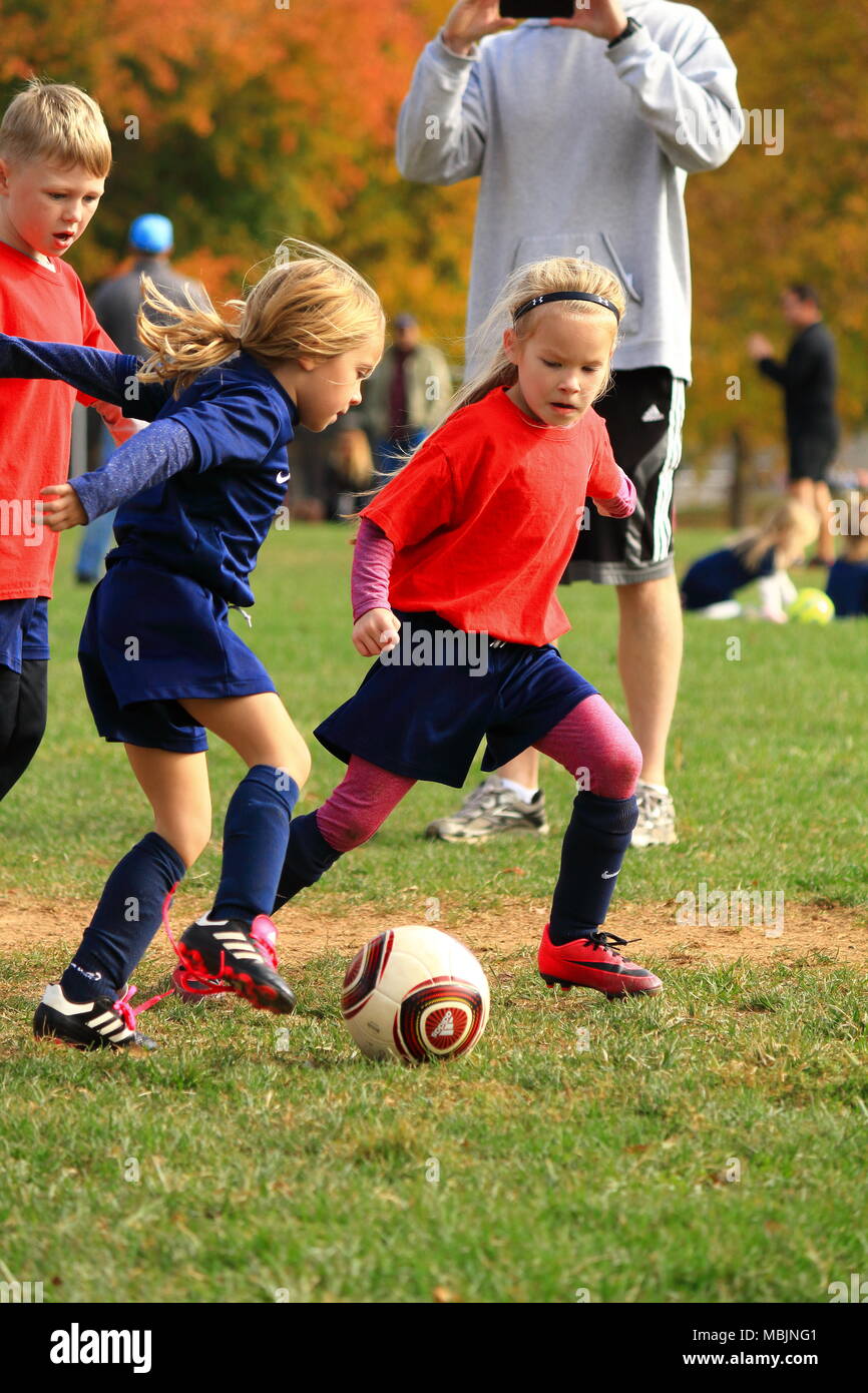 Children playing a soccer game Stock Photo