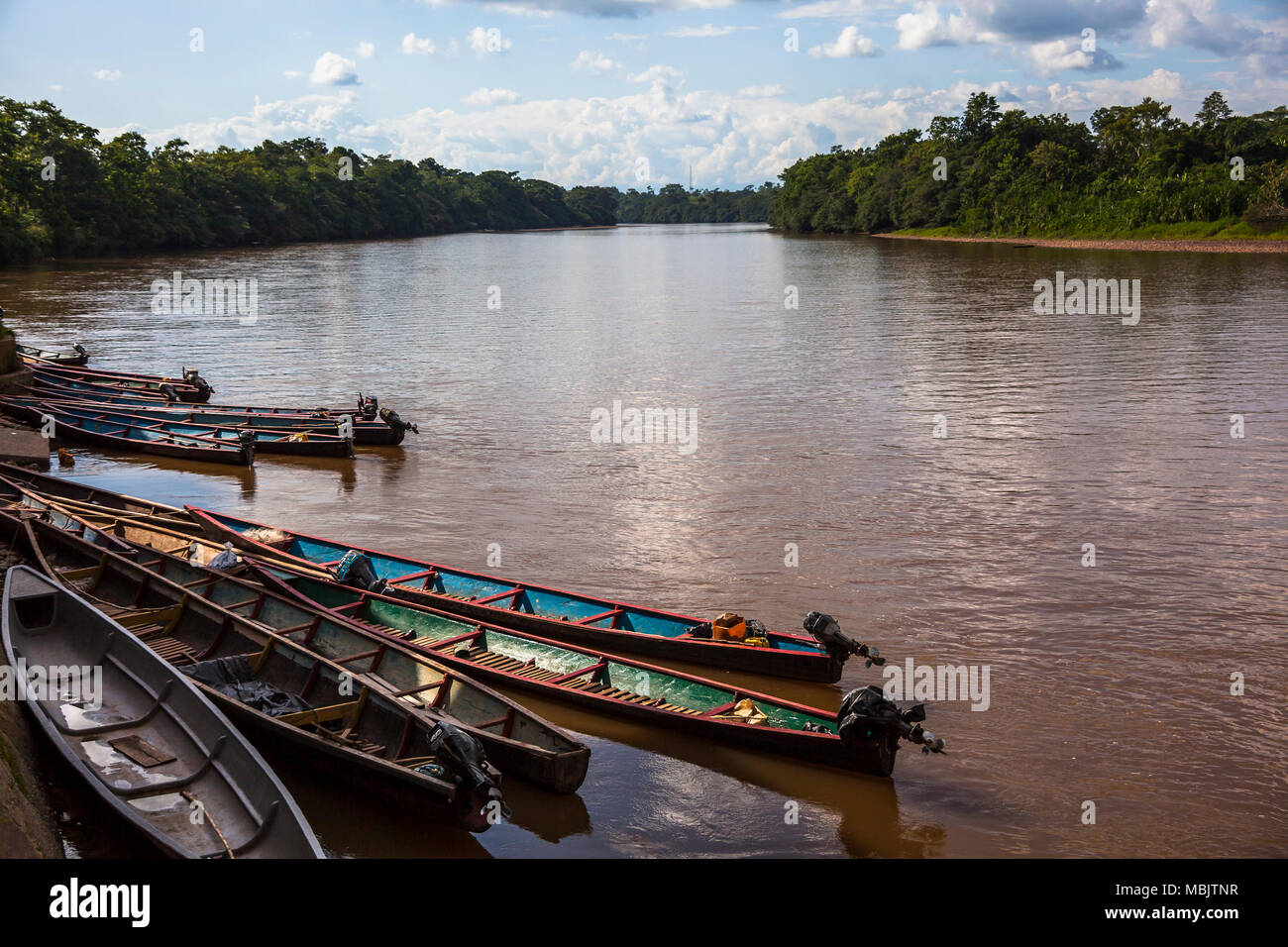 Wooden canoe in Amazon river port, Ecuador Stock Photo Alamy
