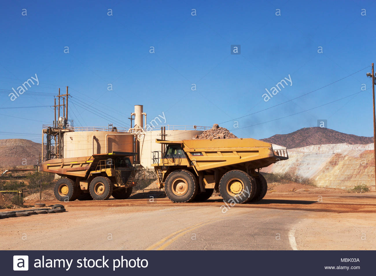 Two mine haul trucks, Caterpillar 777D, 100 tons payload capacity