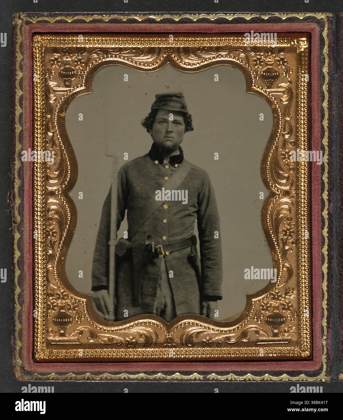Confederate Soldier with frock coat and forage cap Stock Photo