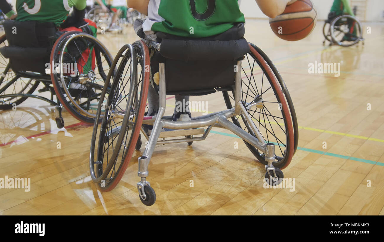 Disabled sportsmen plays wheelchair basketball Stock Photo Alamy