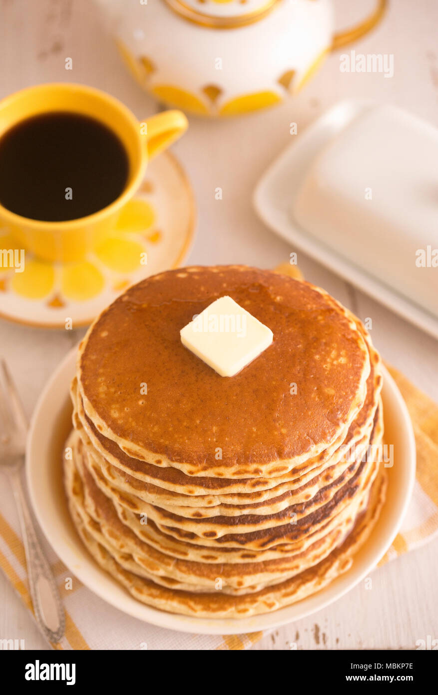 A Stack of Fresh Buttermilk Pancakes with Butter and Syrup Stock Photo