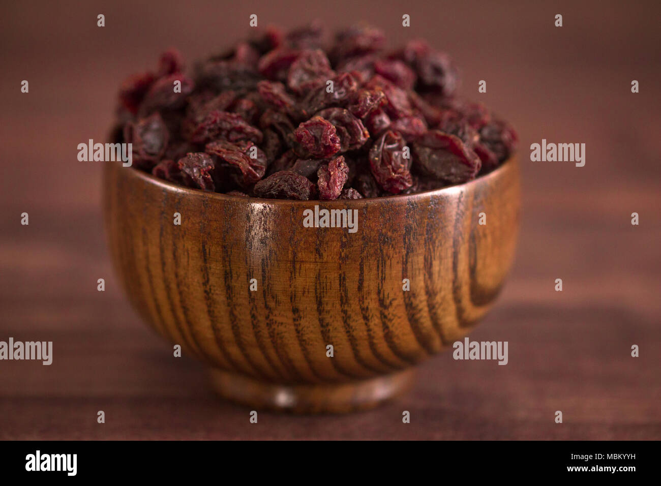 Dried Cranberries in a Wooden Bowl Stock Photo