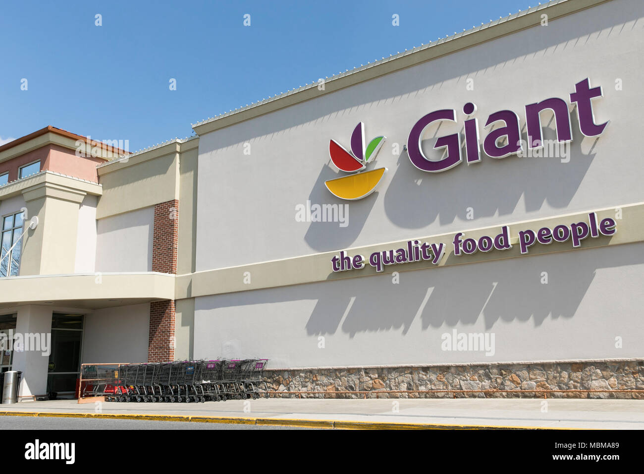 A logo sign outside of a Giant Food grocery retail store location in