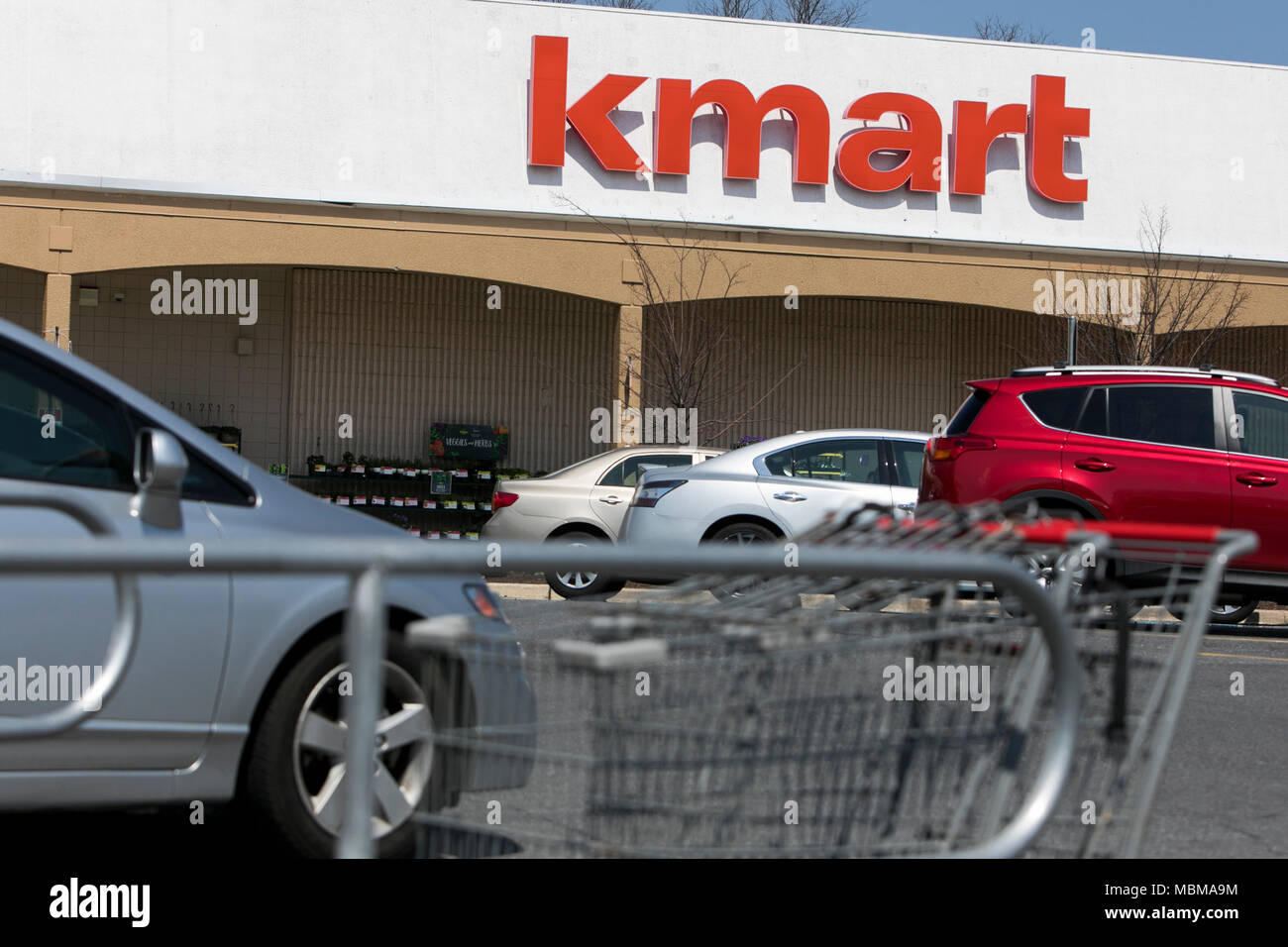 A logo sign outside of a Kmart retail store location in Silver Spring, Maryland on April 10