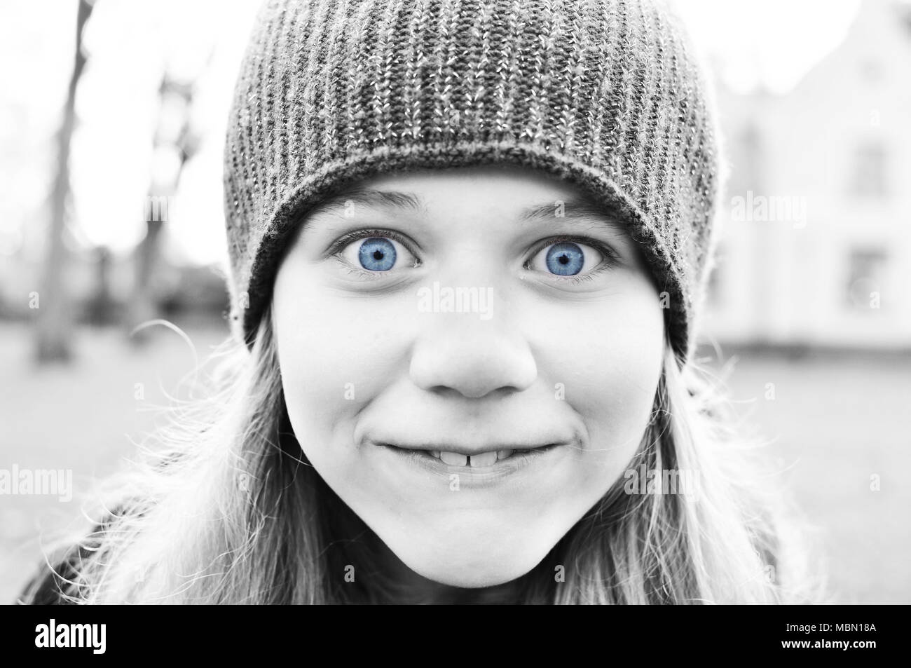 Black and white image of silly girl with blue eyes. Stock Photo