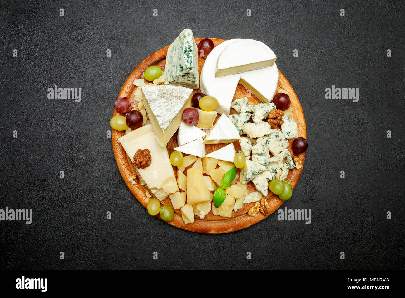 Cheese plate with Assorted cheeses Camembert, Brie, Parmesan blue cheese, goat Stock Photo Alamy