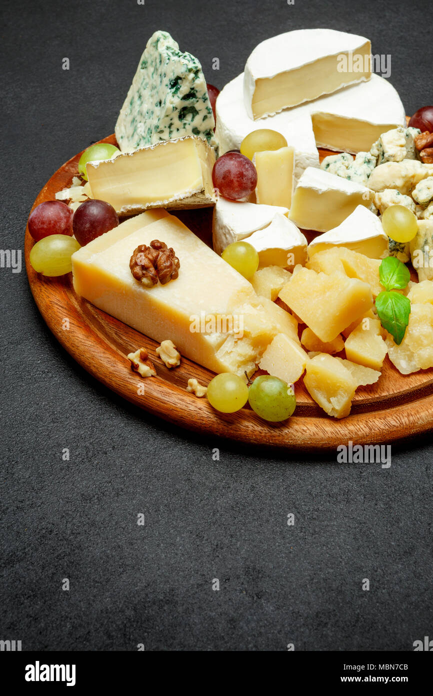 Cheese plate with Assorted cheeses Camembert, Brie, Parmesan blue cheese, goat Stock Photo Alamy