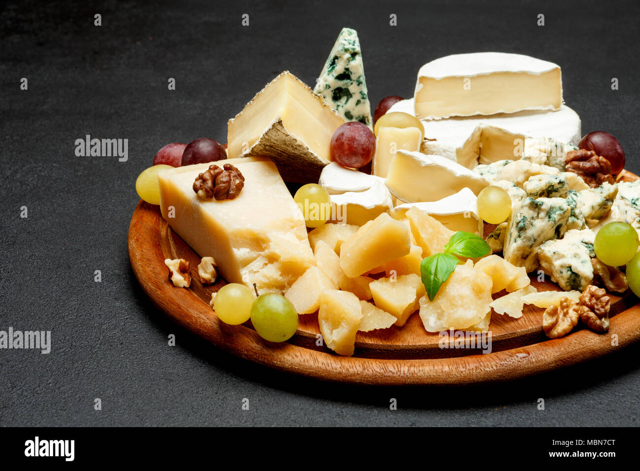 Cheese plate with Assorted cheeses Camembert, Brie, Parmesan blue