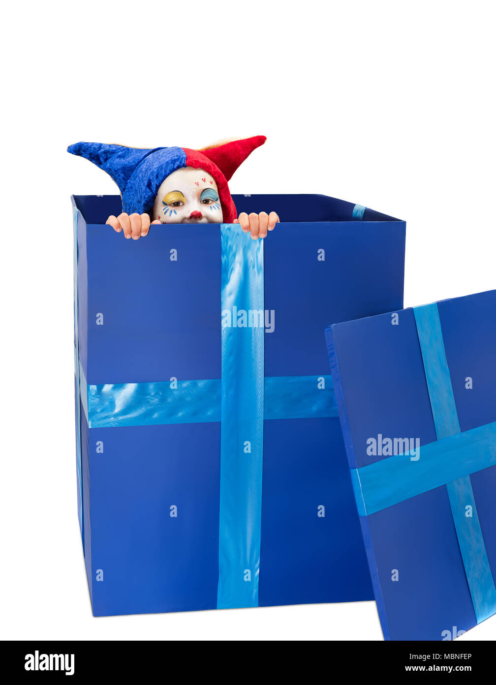 Peek-a-boo girl in a blue box dressed up like a clown Stock Photo