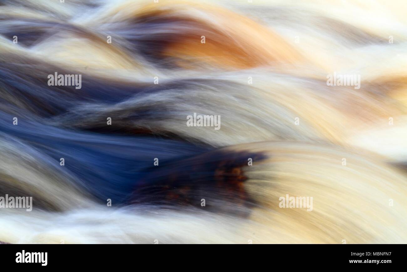 Rapids in a river flowing strongly Stock Photo