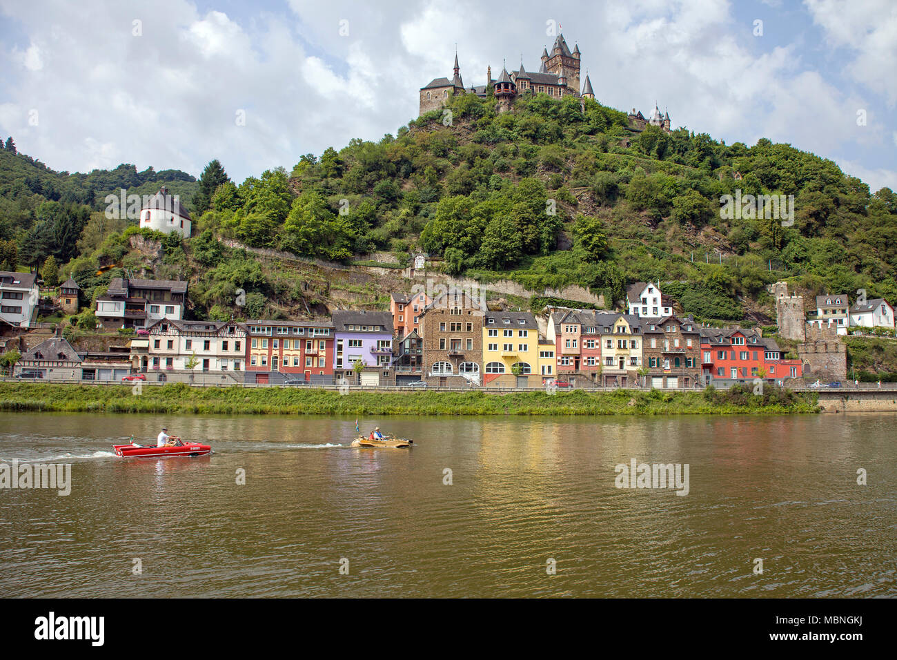 Amphibious vehicle driving on Moselle river, passing the imperial castle, Cochem, Rhineland-Palatinate, Germany Stock Photo