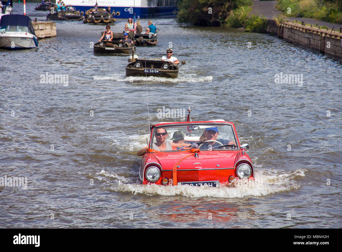 Amphic car and military amphibious vehicles on Moselle river at Cochem, Rhineland-Palatinate, Germany Stock Photo