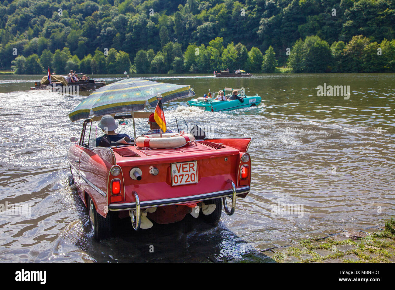 Amphic car, a german amphibious vehicle driving on Moselle river at Minheim, Rhineland-Palatinate, Germany Stock Photo
