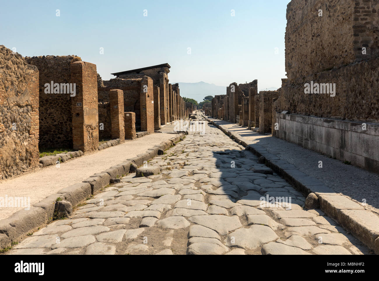 An Ancient Cobbled Street In The Ruins Of Pompeii, Italy Stock Photo ...