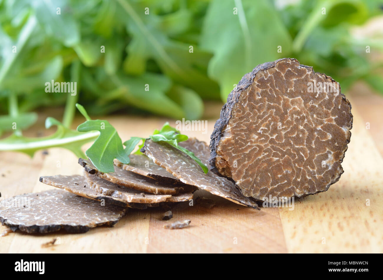 Sliced fresh black truffle / tuber uncinatum Stock Photo