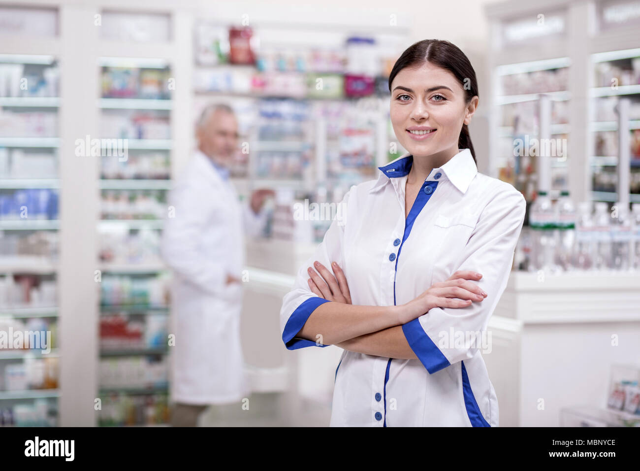 Beautiful female pharmacist preparing for work Stock Photo
