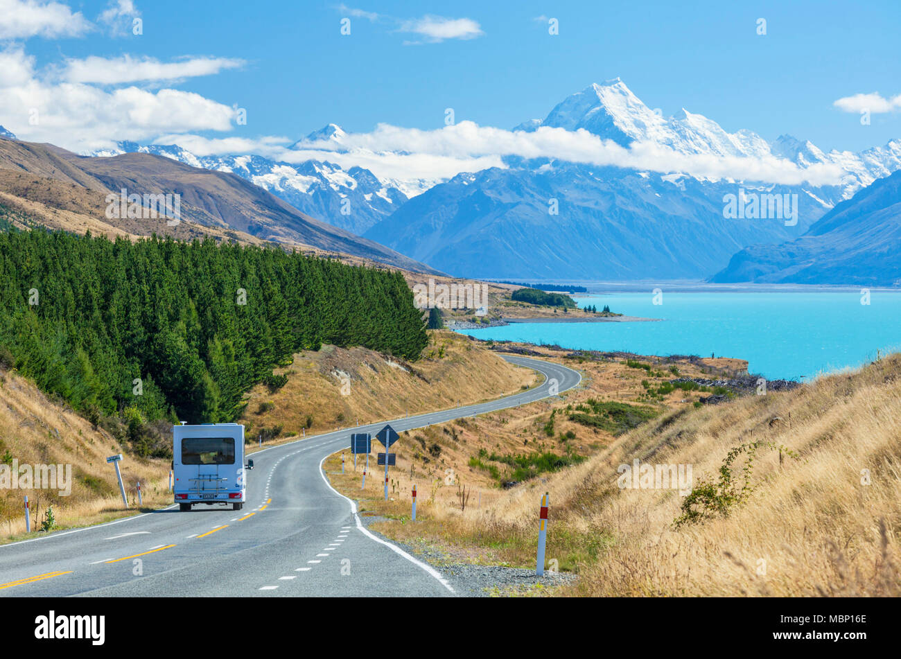 new zealand south island new zealand motor home travelling on a winding road to mount cook national park by the side of lake pukaki new zealand nz Stock Photo