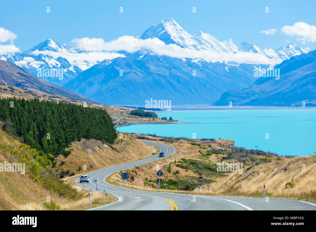 new zealand south island new zealand winding road through mount cook national park next to the glacial lake Pukaki new zealand  mackenzie district nz Stock Photo