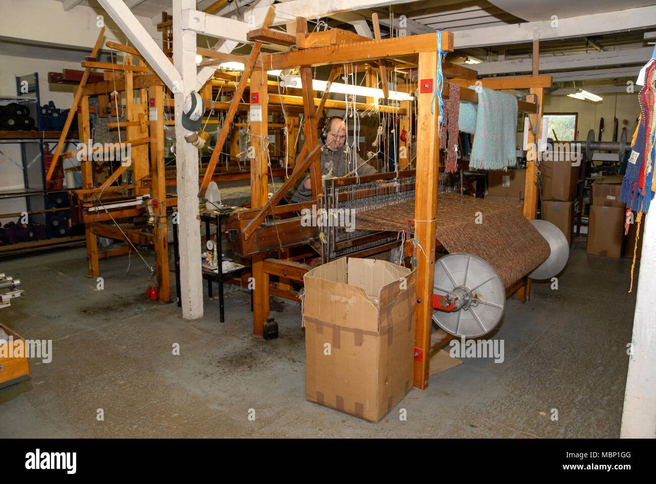 A skilled hand weaver operating a 110yearold Fly Shuttle Loom at the