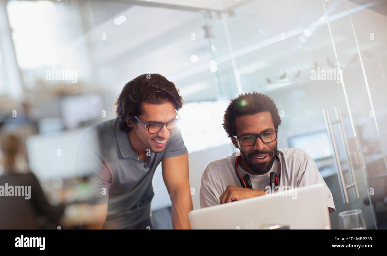 Creative businessmen using laptop in office Stock Photo