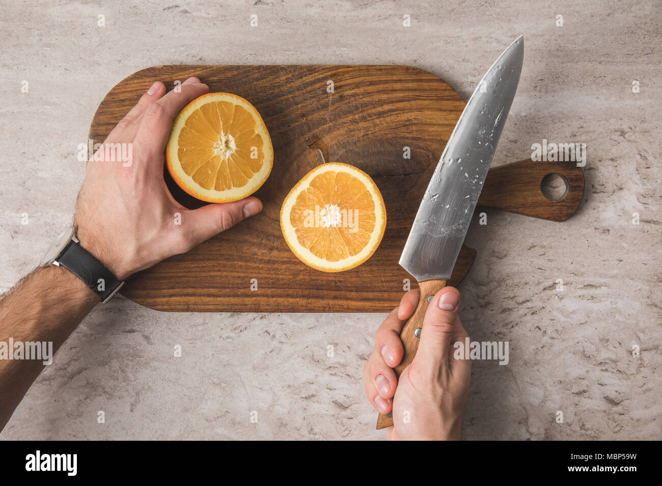 Cutting orange hi-res stock photography and images - Alamy