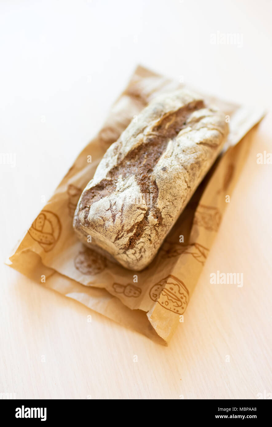 Brown bread on a paper bag with a pattern Stock Photo - Alamy