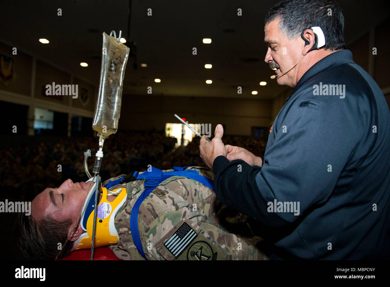 Ronny Garcia, right, safety training coordinator, demonstrates the actions taken using life-saving equipment on Senior Airman Cody Stoltenburg, 71st Rescue Squadron intelligence analyst, during a Street Smart presentation, Jan. 2, 2018, at Moody Air Force Base, Ga. The presenters utilized Airmen to simulate the potential results of drunk driving. Street Smart is a safety program designed to emphasize the dangers of making poor decisions and then driving a vehicle. (U.S. Air Force photo by Airman 1st Class Erick Requadt) Stock Photo