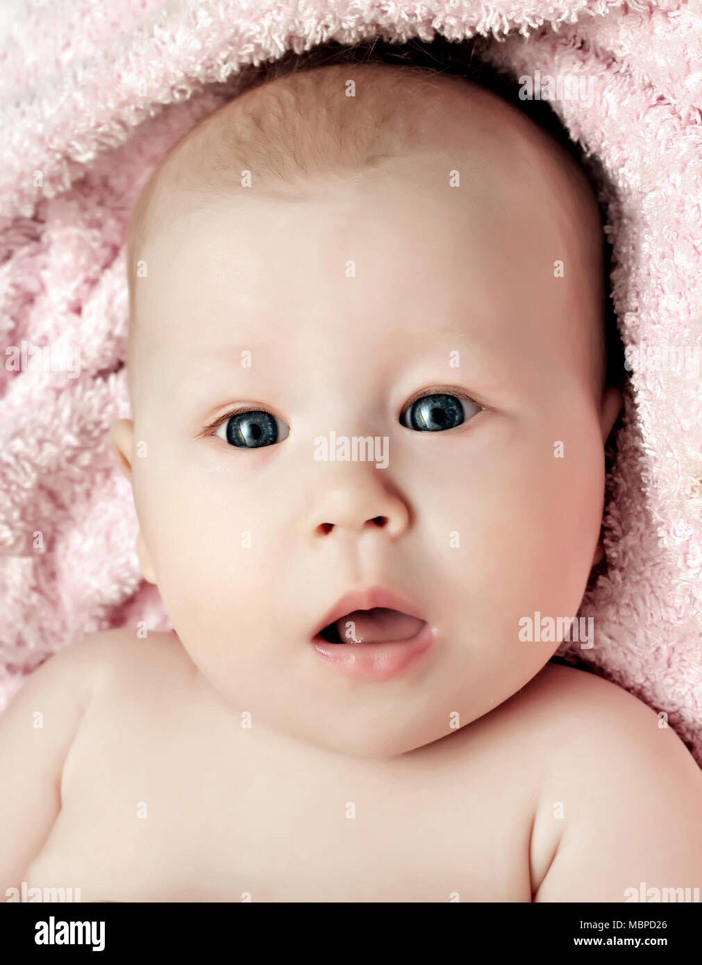 Newborn baby girl with open mouth on the blanket Stock Photo Alamy