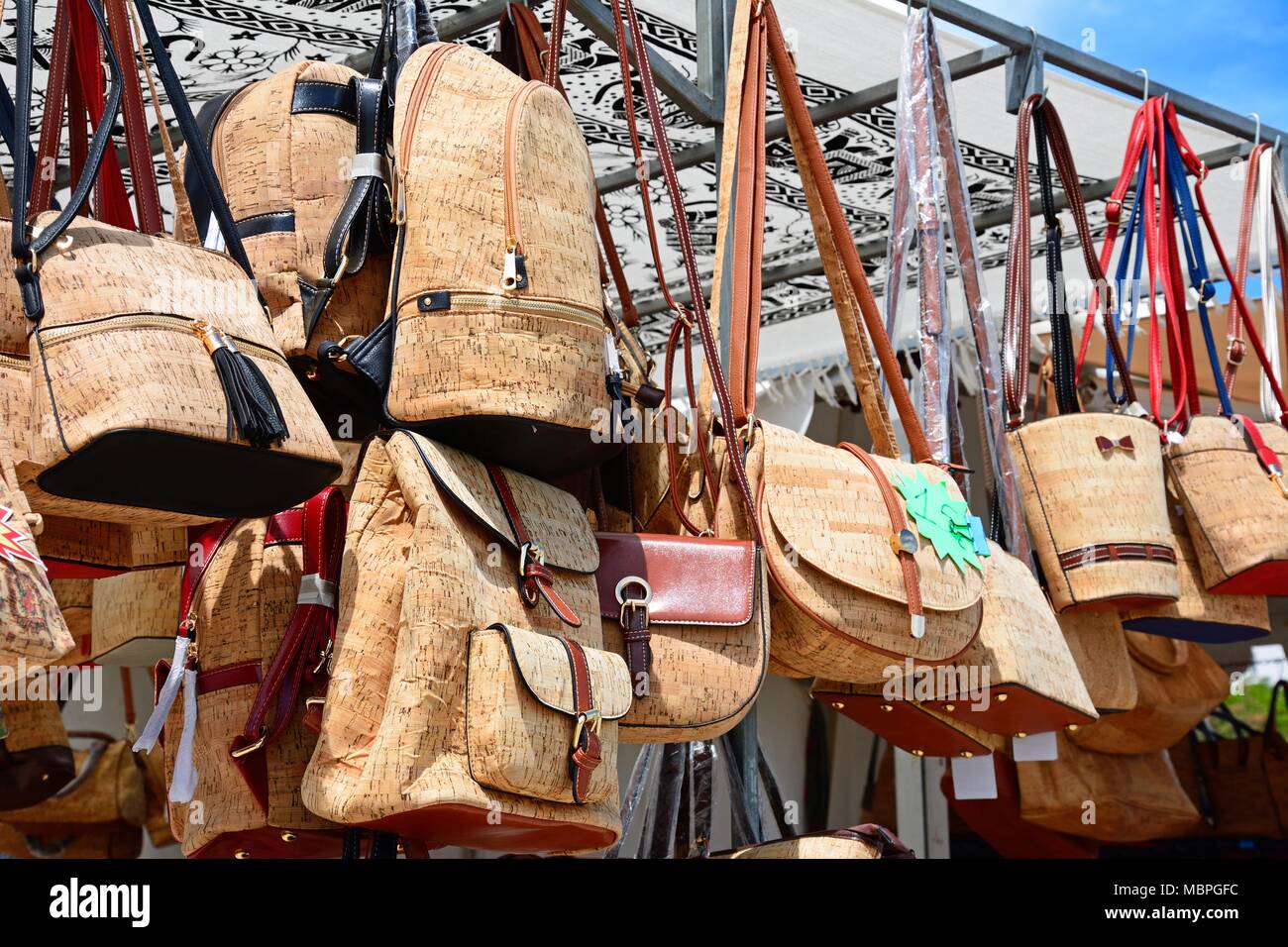Market stall selling traditional Portuguese cork handbags along the Avenida dos Descobrimentos, Lagos, Algarve, Portugal, Europe. Stock Photo