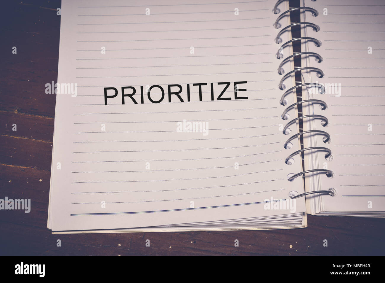 prioritize word written on white paper Stock Photo